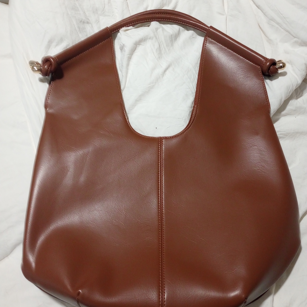 Elegant Brown Leather Tote Bag from Anthropologie.